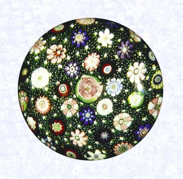 <B>Moss Carpet Ground Millefiori<BR>France<BR>Clichy, circa 1845-55</B><BR>Diameter: 8 cm (3 1/8 inches)<BR>(702274)<BR><BR>&quotMoss" carpet ground inset with spaced millefiori canes, including one large pink Clichy rose