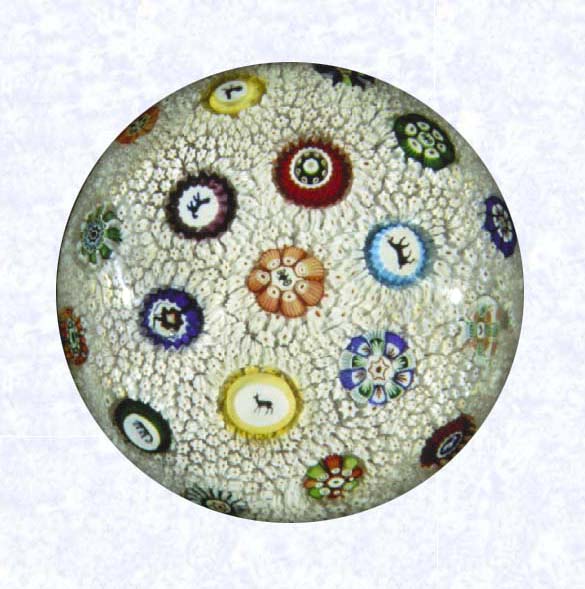 <B>Stardust Millefiori<BR>France<BR>Baccarat (signed), dated 1848</B><BR>Diameter: 7.6 cm (3 inches)<BR>(702297)<BR><BR>&quotStardust" carpet ground inset with spaced millefiori canes, including nine silhouettes and one signed and dated cane inscribed &quotB/1848"