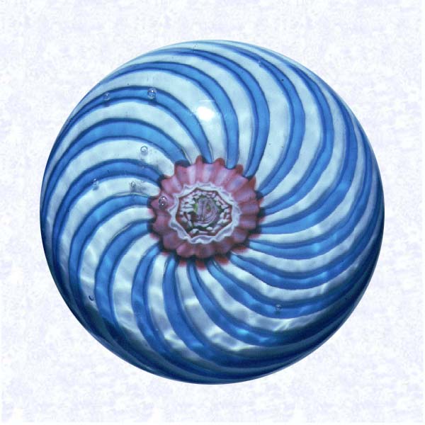<B>Turquoise and White Swirl<BR>France<BR>Clichy, circa 1845-55</B><BR>Diameter: 4.5 cm (1 3/4 inches)<BR>(702422)<BR><BR>Miniature swirl weight in two alternating colors (turquoise and white), around a pink and white floret center containing a small pink Clichy rose