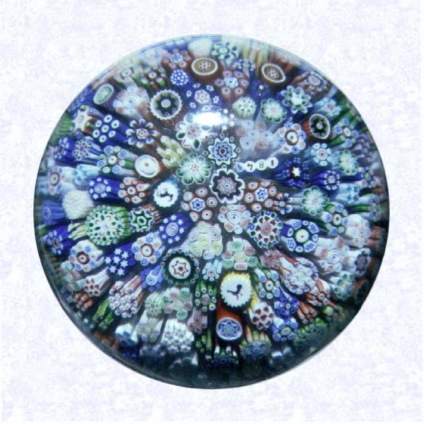 <B>Close Millefiori<BR>France<BR>Baccarat, dated 1849</B><BR>Diameter: 7 cm (2 3/4 inches)<BR>(702436)<BR><BR>Close millefiori, including two silhouette canes and one dated cane inscribed &quot1849."