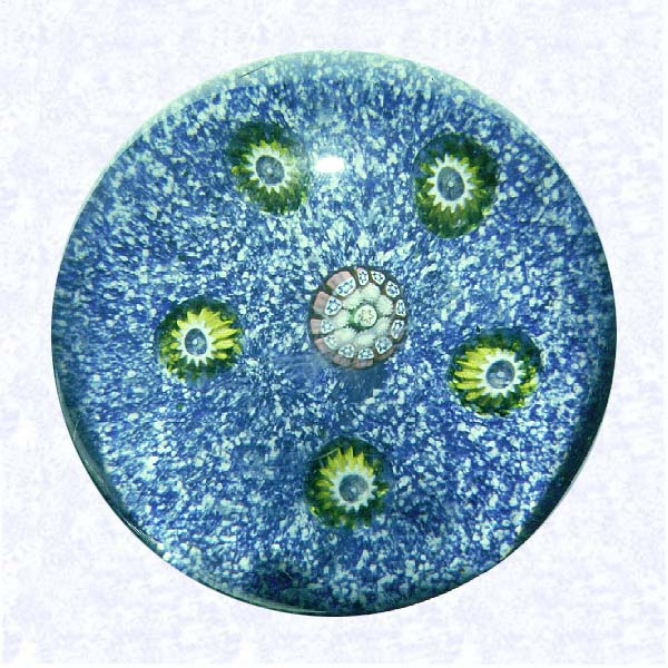 <B>Pattern Millefiori on Jasper<BR>France<BR>Saint Louis, circa 1845-55</B><BR>Diameter: 7 cm (2 3/4 inches)<BR>(702473)<BR><BR>Pattern millefiori with five chartreuse and white millefiori canes spaced around a central pink, white, and blue cane; on a blue and white jasper ground