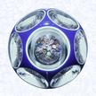 Double Overlay with MushroomFrance Baccarat, circa 1845-55Diameter: 8.2 cm 3 1/4 inches)(702248)Double overlay (opaque white overlaid with dark blue), enclosing a close concentric millefiori mushroom; star-cut base; sides cut with six circular printies, one on top