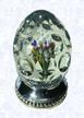Lampworked HandcoolerFranceSaint Louis, circa 1845-55Diameter: 4.5 cm (1 3/4 inches, Height: 7 cm (2 3/4 inches(702256)Lampworked upright bouquet in an egg-shaped handcooler; sides cut with four rows of circular printies; circular sterling silver base