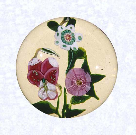 <B>Rose and Pansy Lampworked Bouquet<BR>France<BR>Clichy, circa 1845-55</B><BR>Diameter: 6.5 cm (2 1/2 inches)<BR>(702268)<BR><BR>Flat lampworked bouquet of one pink Clichy rose, one rose and white pansy and bud, and one green and white flower with bud; green leaves and stems