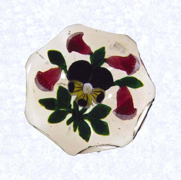 <B>Lampworked Pansy and Gentian Bouquet<BR>France<BR>Baccarat, circa 1845-55</B><BR>Diameter: 7.6 cm (3 inches)<BR>(702287)<BR><BR>Lampworked flat bouquet of one purple and yellow pansy and four light scarlet gentians with green leaves and stems; star-cut base; sides cut with seven circular printies