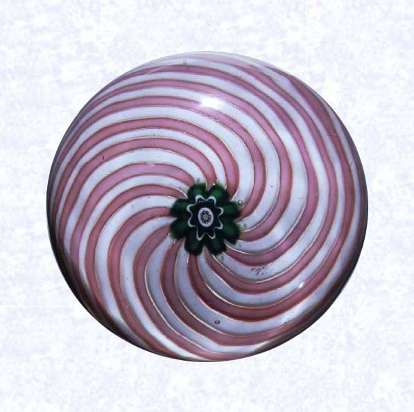 <B>Pink and White Swirl<BR>France<BR>Clichy, circa 1845-55</B><BR>Diameter: 7 cm (2 3/4 inches)<BR>(702289)<BR><BR>Swirl weight in two alternating colors (pink and white), around a green and white floret center