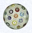 Stardust MillefioriFranceBaccarat (signed), dated 1848Diameter: 7.6 cm (3 inches)(702297)&quotStardust" carpet ground inset with spaced millefiori canes, including nine silhouettes and one signed and dated cane inscribed &quotB/1848"