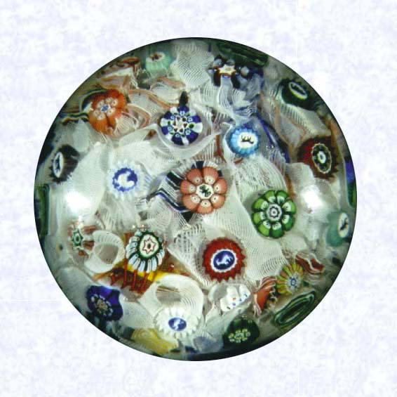 <B>Spaced Millefiori on Filigree<BR>France<BR>Baccarat (signed), dated 1847</B><BR>Diameter: 7.6 cm (3 inches)<BR>(702303)<BR><BR>Spaced millefiori canes, including twelve silhouette canes and one signed and dated cane inscribed "B/1847;