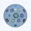 Spaced Millefiori on FiligreeFranceBaccarat, dated 1849Diameter: 6 cm (2 3/8 inches)(702310)Spaced millefiori canes, including five silhouette canes and one dated cane inscribed " 1849;" on a white filigree ground