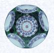 Emerald Green OverlayFranceBaccarat, circa 1945-55Diameter: 6.7 cm (2 5/8 inches)(702314)Single overlay of translucent emerald green, enclosing a spaced concentric millefiori design; sides cut with five circular printies, one on top