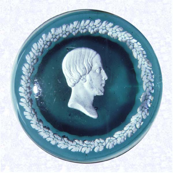 <B>Comte de Chambord Sulphide Portrait<BR>France<BR>Baccarat, circa 1845-55</B><BR>Diameter: 7.3 cm (2 7/8 inches)<BR>(702327)<BR><BR>Sulphide portrait of the Comte de Chambord (Duc D'Orleans and would-be King Henri V, but for his refusal to adopt the Tricolor flag of the French Revolution); encircled by a ring of green and white Baccarat whorl (spiral design in cross section) canes; set on a dark green ground