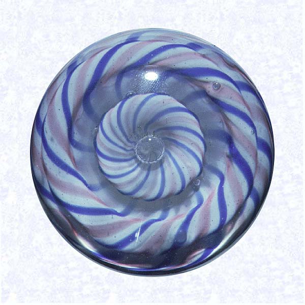 <B>Four-layered Swirl<BR>United States (?)<BR>factory unknown, twentieth century</B><BR>Diameter: 5 cm (2 inches)<BR>(702351)<BR><BR>Miniature blue, pink, and white four-layered swirl weight with a clear glass bubble center