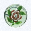 Miniature Pink Lampworked PrimroseFranceBaccarat, circa 1845-55Diameter: 4.2 cm (1 5/8 inches)(702391)Miniature weight with a deep pink and white banded lampworked primrose blossom with a white center cane; five green leaves and stem