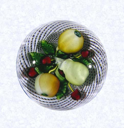 <B>Pears, Apple, and Cherries in Latticinio Basket<BR>France<BR>Saint Louis, circa 1845-55</B><BR>Diameter: 7.3 cm (2 7/8 inches) <BR>(702417)<BR><BR>Lampworked fruit weight with two pears, one apple, five cherries, and green leaves; set in a white latticinio basket