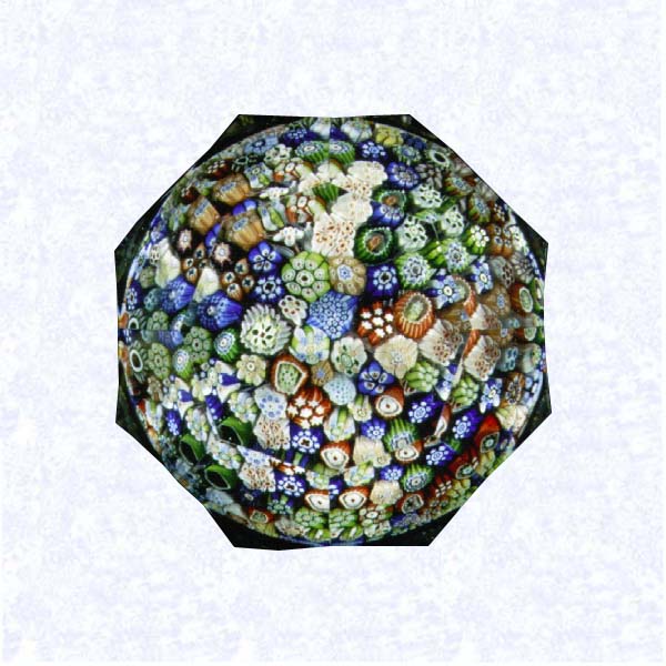 <B>Signed Close Millefiori<BR>France<BR>Baccarat (signed), dated 1846</B><BR>Diameter: 7 cm (2 3/4 inches)<BR>(702437)<BR><BR>Close millefiori, including one signed and dated cane inscribed &quotB/1846;" sides cut with three rows of five- and six-sided facets; eight-sided facet on top