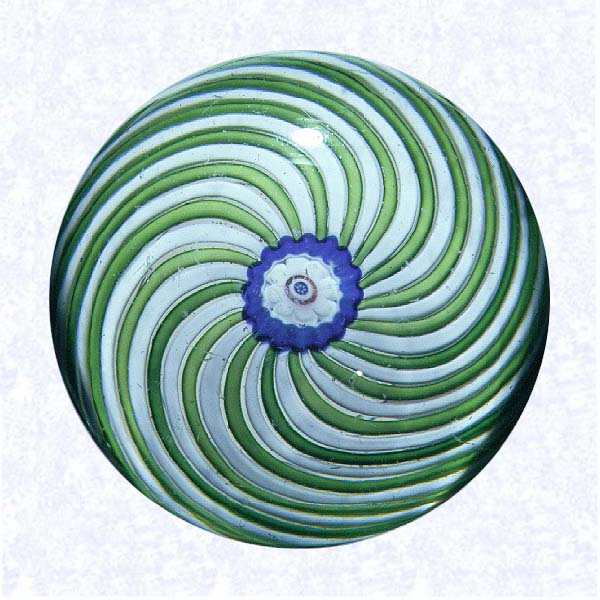 <B>Green and White Swirl<BR>France<BR>Clichy, circa 1845-55</B><BR>Diameter: 8 cm (3 1/8 inches)<BR>(702441)<BR><BR>Swirl weight in two alternating colors (pale green and white), around a large blue and white floret center