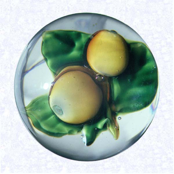 <B>Two Lampworked Apples<BR>France<BR>Pantin (attributed), late nineteenth century</B><BR>Diameter: 7.6 cm (3 inches)<BR>(702443)<BR><BR>Lampworked fruit weight with two yellow-orange apples, stem, and three bright green leaves