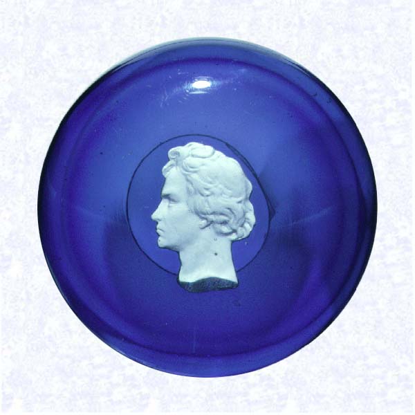 <B>Sulphide Portrait of Meyerbeer<BR>France (?)<BR>factory unknown, mid- to late-nineteenth century</B><BR>Diameter: 9.2 cm (3 5/8 inches)<BR>(702458)<BR><BR>Sulphide profile portrait of German pianist and composer, Giacomo Meyerbeer (1791-1864); &quotMeyerbeer" inscribed on plinth; set on a translucent dark blue footed base