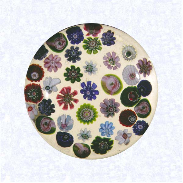 <B>Spaced Millefiori<BR>France<BR>Clichy, circa 1845-55</B><BR>Diameter: 8.2 cm (3 1/4 inches)<BR>(702479)<BR><BR>Spaced millefiori canes, including five pink Clichy roses