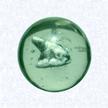 Sulphide MarbleEurope or United Statesfactory unknown, circa 1920Diameter: 3.5 cm (1 3/8 inches)(702489)Clear glass marble enclosing a sulphide figure of a seated dog