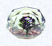Faceted Upright Lampworked BouquetFranceBaccarat, circa 1845-55Diameter: 7.6 cm (3 inches)(702320)Upright bouquet with a pink torsade; star-cut base; entire surface of weight cut with triangular facets