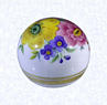 Handpainted PaperweightBohemia (attributed)factory unknown, circa 1850-1900Diameter: 6.5 cm (2 1/2 inches)(702341)(view one)Clear glass weight overlaid with opaque white glass; hand-painted flowers in pink, yellow, and rust with green leaves; two gilded bands encircling base; deep star-cut extending to perimeter of base